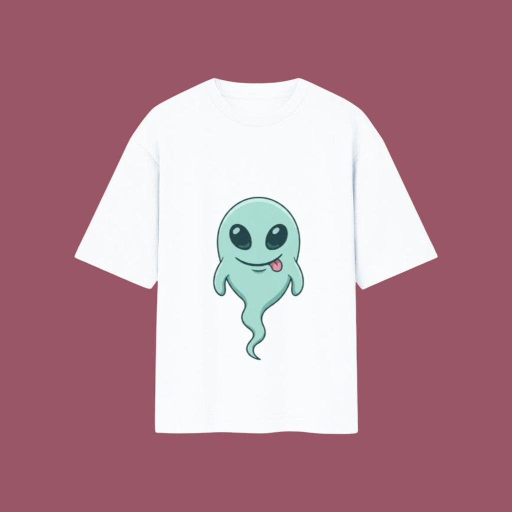 Flat-lay mockup of an oversized white t-shirt featuring a cute, smiling green alien ghost graphic from the anime Dan Da Dan, displayed against a solid mauve background.
