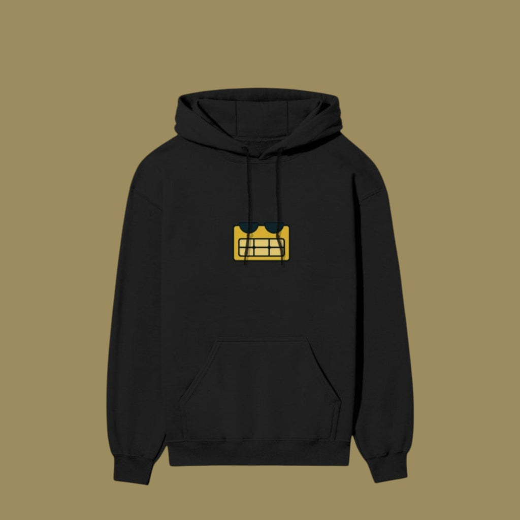 Flat lay of a black pullover hoodie featuring a yellow, pixelated alien face graphic with sunglasses on the center chest, inspired by the Dan Da Dan anime