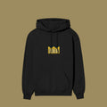 Flat lay of a black pullover hoodie featuring a yellow, pixelated alien face graphic with sunglasses on the center chest, inspired by the Dan Da Dan anime