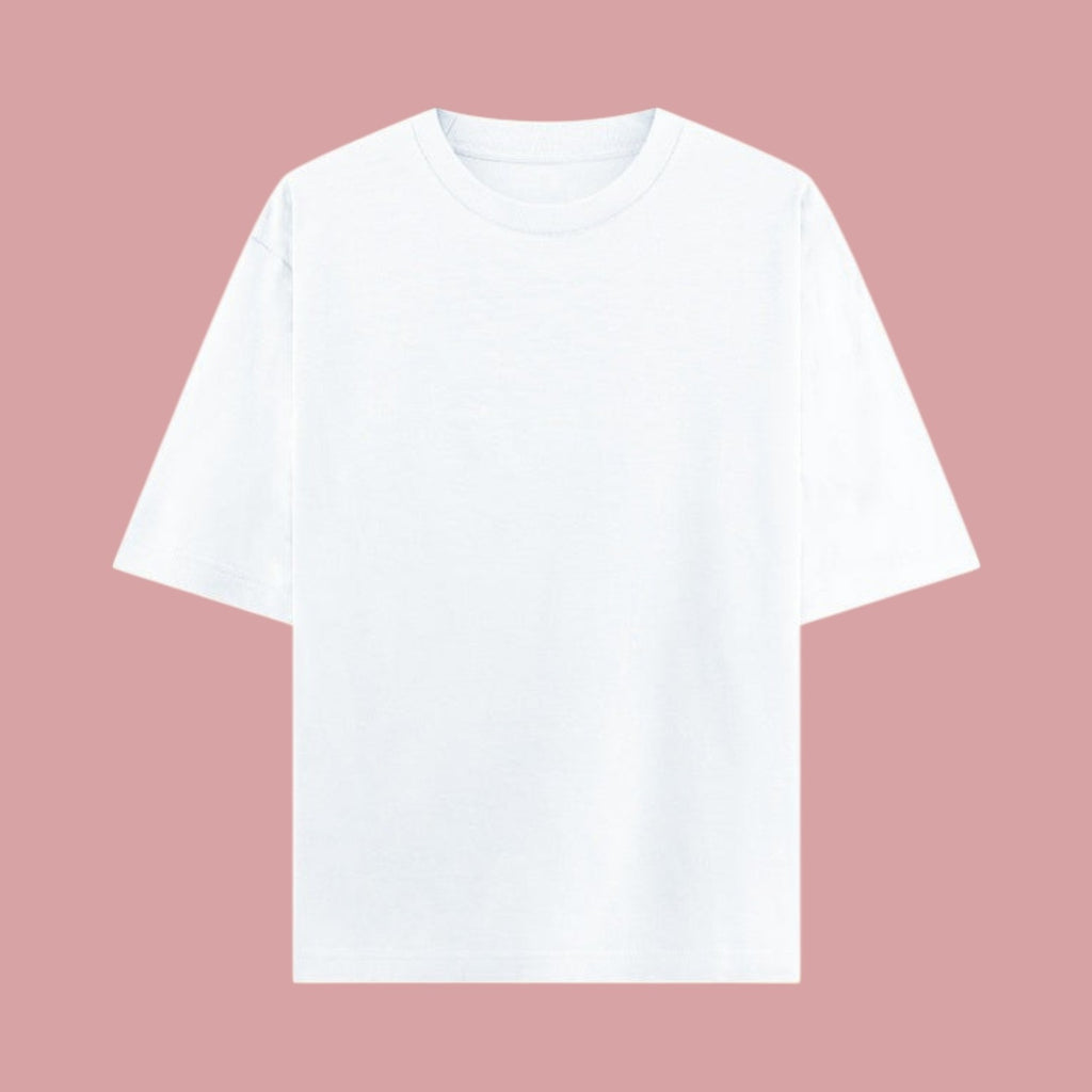 Flat lay mockup showing the front of a plain white, short-sleeve oversized t-shirt from the Dan Da Dan anime streetwear collection against a pink background