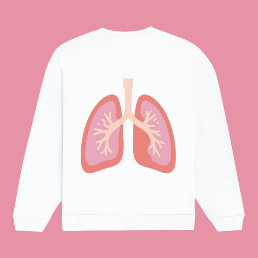 Flat product mockup showing the back of a white crewneck sweatshirt. The design features a stylized, pastel pink and red anatomical illustration of human lungs centered on the back.
