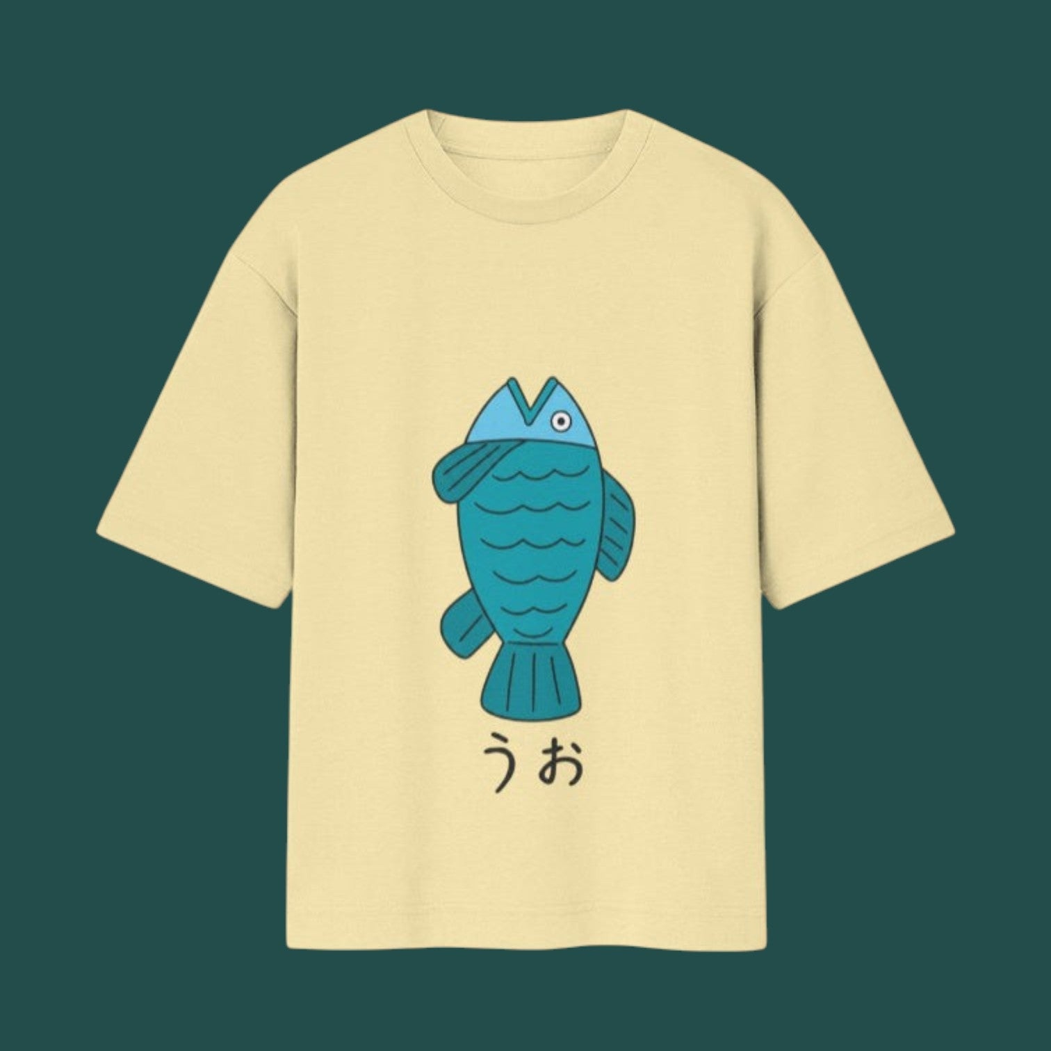 Front view of a pale yellow t-shirt from the Dandadan collection, featuring Momo Ayase's iconic blue cartoon fish design and Japanese text
