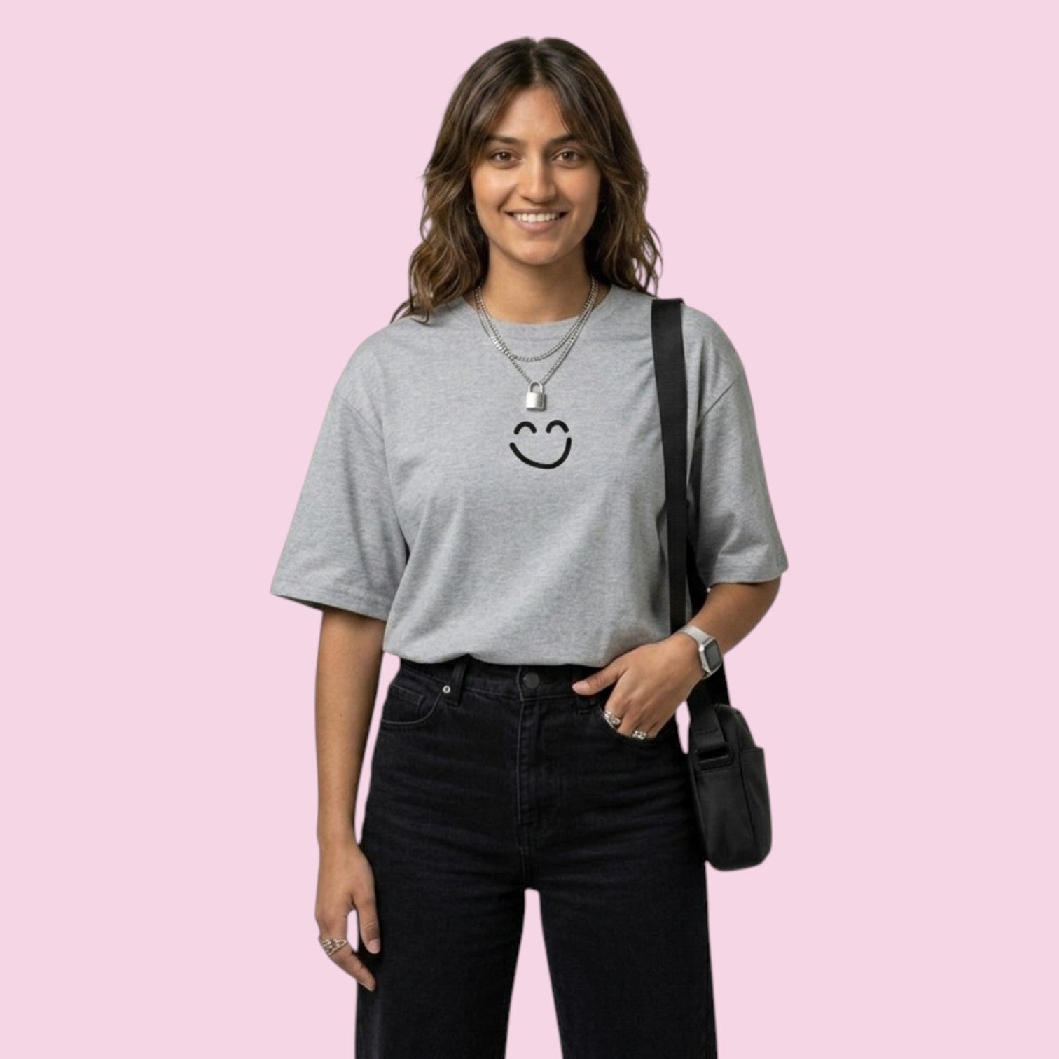 Woman wearing an oversized grey Momo Ayase t-shirt with a minimalist black smiley face from the Dan Da Dan anime, styled as casual streetwear.